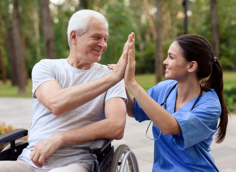 nurse-old-man-wheelchair-high-five