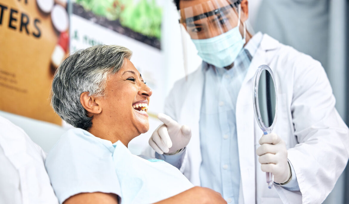 Dental, healthcare or mirror with a dentist and patient consulting in an oral hygiene appointment. Teeth, cleaning and mature woman client at the orthodontist for a medical checkup to prevent decay.