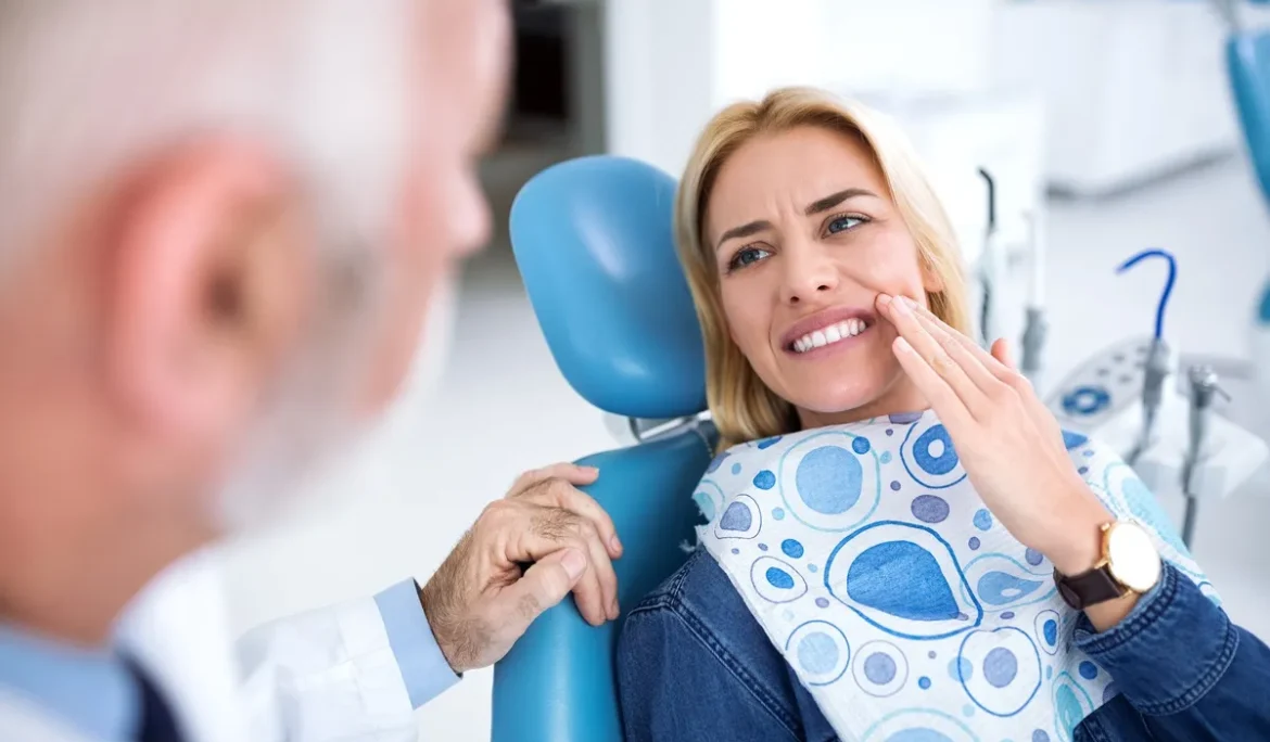 A young patient visits the dentist because she has tooth pain